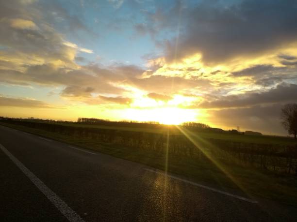 istock Heavenly dusk / dawn sunbeam over country highway 1085096630