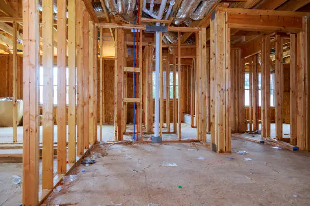 Interior framing of a new house under construction construction home framing