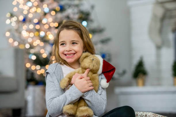 istock Smiling girl with teddy bear 1085100978