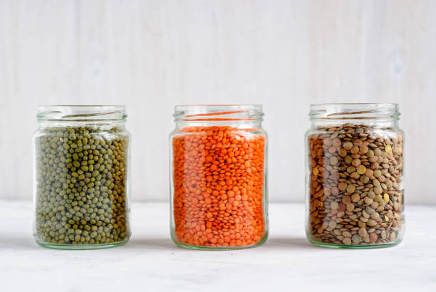 istock Dried Mung beans, and lentils in glass jars 1085102878