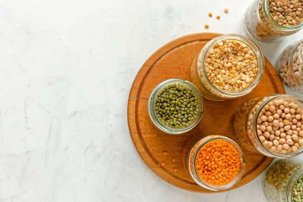 istock Assorted dry legumes and pulses in glass jars 1085102882