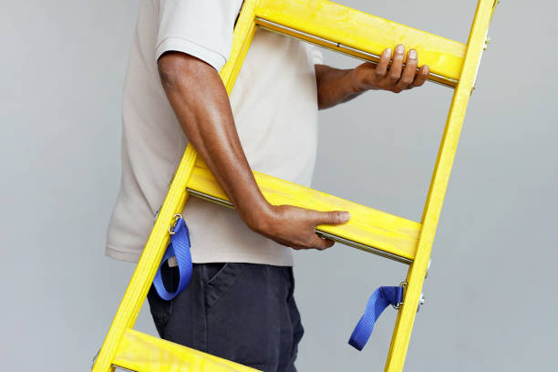 istock worker with wooden ladder 1085104950