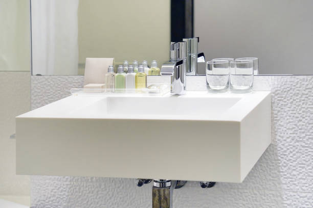 istock Modern white bathroom sink with faucet 1085108262