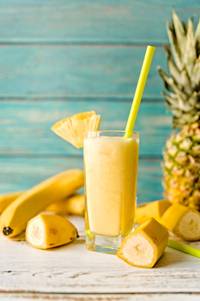 istock pineapple smoothie decorated with banana pieces and pineapples 1085109570
