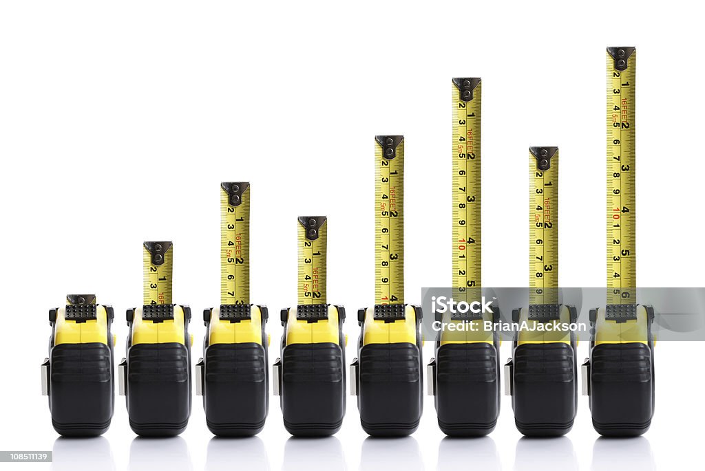 Tape measure bar chart Tape measure bar graph concept with positive trend Tape Measure Stock Photo
