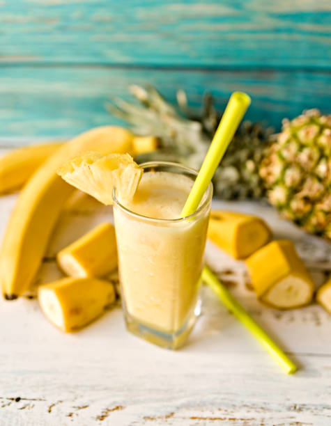 istock pineapple smoothie decorated with banana pieces and pineapples 1085112904