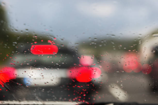 istock View on Autobahn traffic through a wet windshield 1085114310
