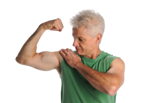 Portrait of mature man flexing biceps isolated over white background