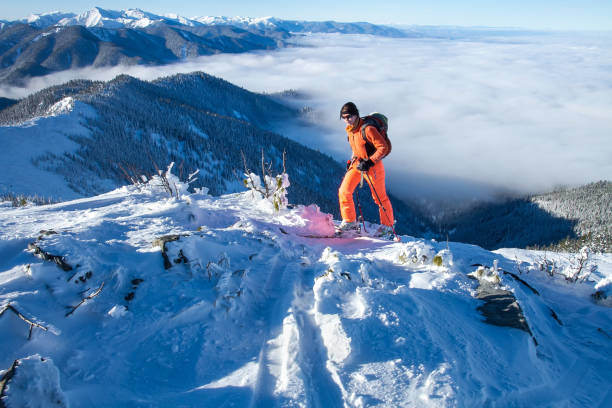 istock A skier walks in the mountains 1085128118