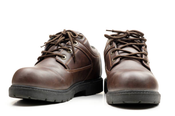 istock Brown leather man shoes isolated 1085129496