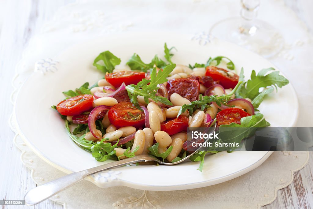 bean salad cannellini bean salad with roast cherry tomatoes,chorizo and red onion Bean Salad Stock Photo