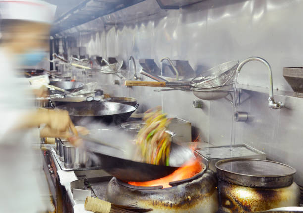 istock Chinese chefs make  dishes in restaurant kitchen. 1085134386