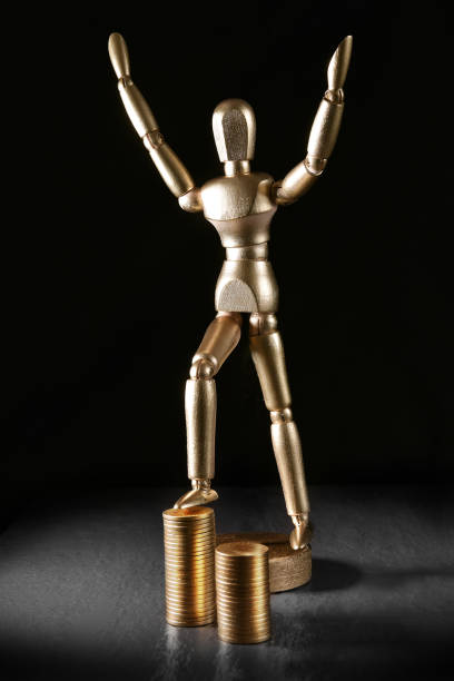 istock Manikin Man Financial Celebration 1085135892