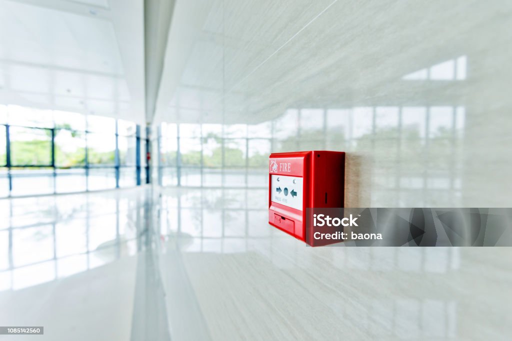 Red fire alarm on white wall Red fire alarm on white wall. Fire - Natural Phenomenon Stock Photo