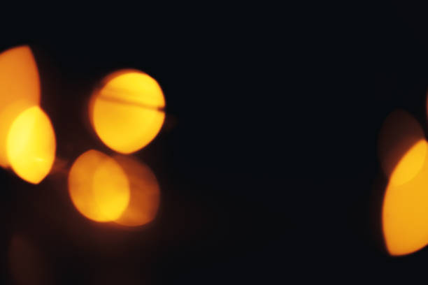istock big light shiny gold bokeh on black background 1085143082