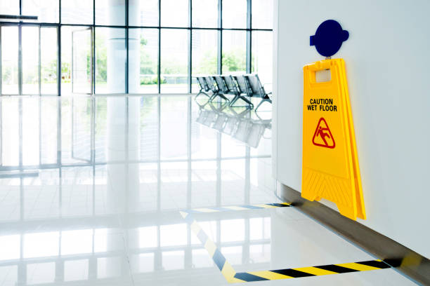istock Wet floor sign hanging on the wall 1085143140