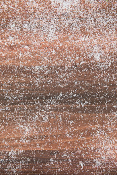istock Wood board with artificial snow flakes all over, free space for text, picture or background, horizontal layout 1085144800