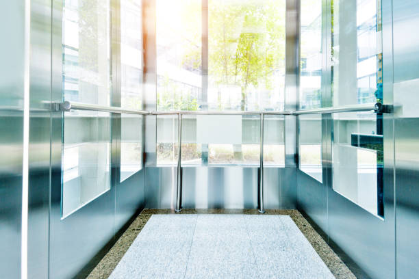 Inside an modern building elevator Inside an modern building elevator. glass steel contemporary nobody stock pictures, royalty-free photos & images