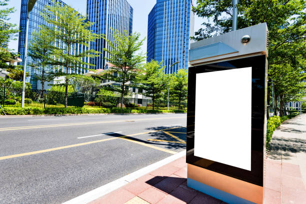 Blank billboard on city street side.