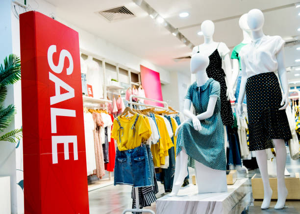 Sale sign at the entrance of clothing store Sale sign at the entrance of clothing store. advertisement photos stock pictures, royalty-free photos & images