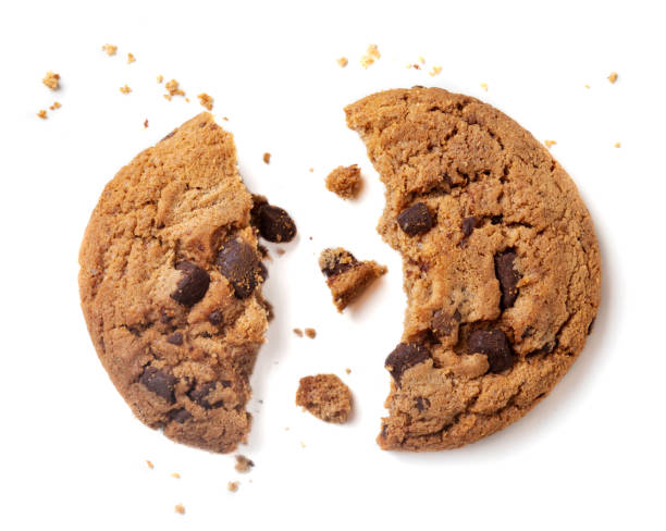 istock Chocolate chip cookie with crumbs isolated on white background.