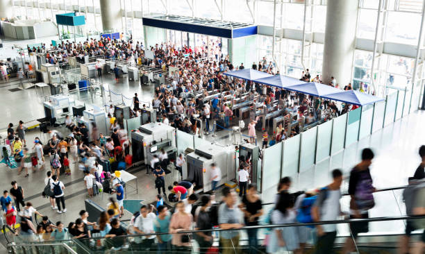 crowd of people on railroad station lobby - escalator people city blurred motion imagens e fotografias de stock