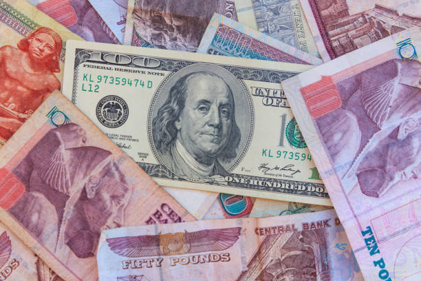 istock One hundred dollar bill on the egyptian pounds banknotes background 1085155166