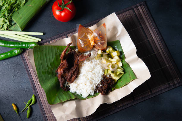 istock nasi lemak kukus with quail meat top view, 1085164190