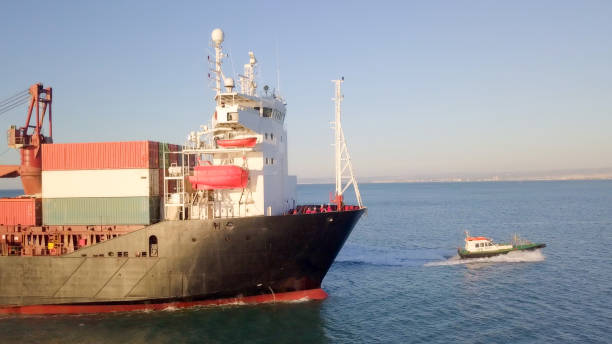 istock Large Cargo and RoRo (Roll On-Off) ship at sea 1085165086