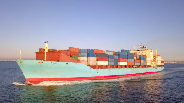 istock Large container ship at sea - Aerial image 1085167068