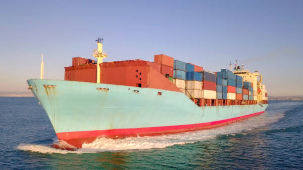 istock Large container ship at sea - Aerial image 1085167150