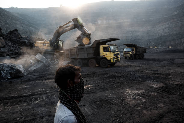 The Curse Of Coal October 25, 2016 : Stones extraction process is going on in the coal mine in Jharia, Dhanbad, India, in order to relieve coal layers. coal mine photos stock pictures, royalty-free photos & images