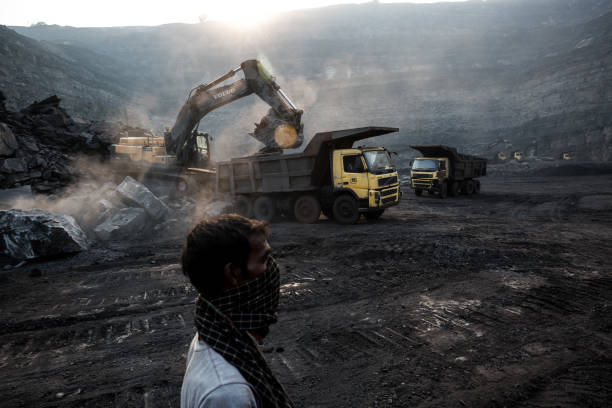 The Curse Of Coal October 25, 2016 : Stones extraction process is going on in the coal mine in Jharia, Dhanbad, India, in order to relieve coal layers. jharkhand photos stock pictures, royalty-free photos & images