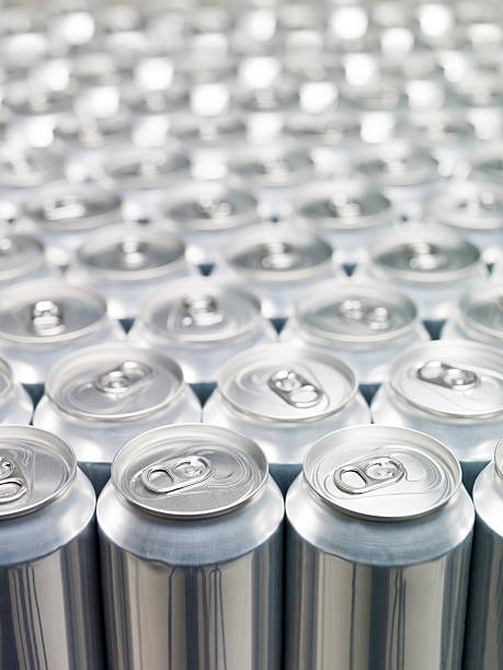 Rows upon rows of aluminum cans with background blur