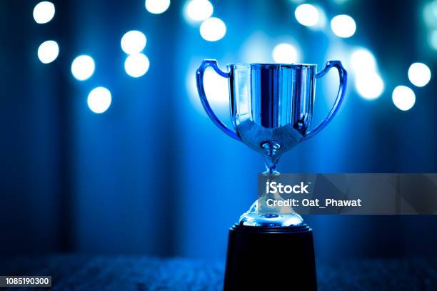 Silver Trophy Competition In The Dark On The Abstract Blurred Light Background With Copy Space Blue Tone Stock Photo - Download Image Now