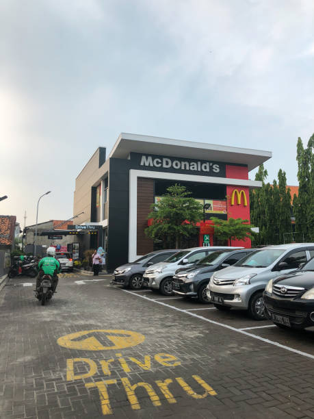 McDonalds Tangerang Tangerang, Indonesia - November 24, 2018: McDonald building view with cloudy sunset sky. tangerang photos stock pictures, royalty-free photos & images