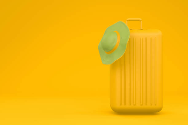 istock Summer Travel concept, hat and suitcase on yellow background 1085193824