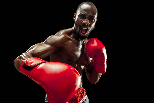 istock Hand of boxer over black background. Strength, attack and motion concept 1085200246