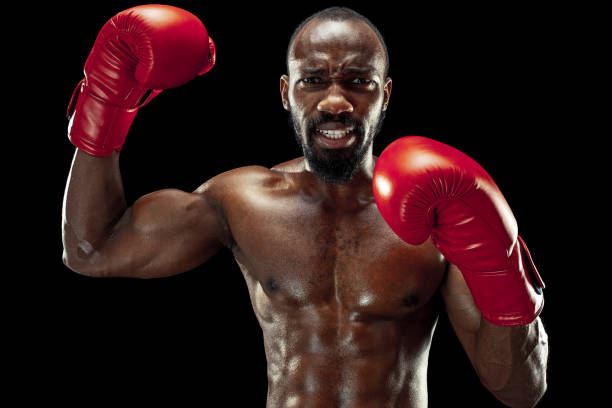 istock Hand of boxer over black background. Strength, attack and motion concept 1085200272