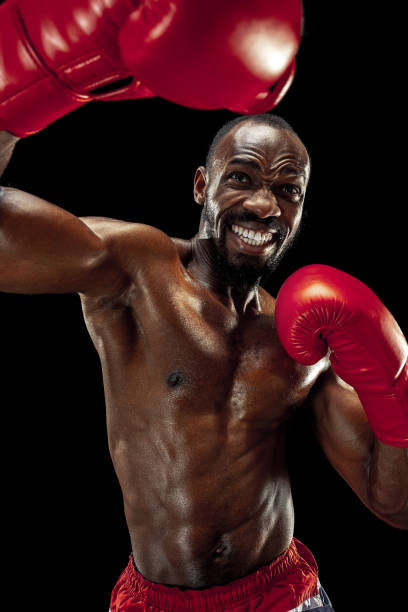 istock Hand of boxer over black background. Strength, attack and motion concept 1085200346