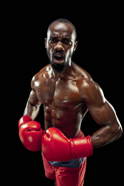 istock Hand of boxer over black background. Strength, attack and motion concept 1085200348