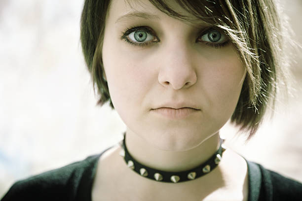 gothic girl emo or goth young woman, natural light, special toned, selective focus on eye black hair emo girl stock pictures, royalty-free photos & images