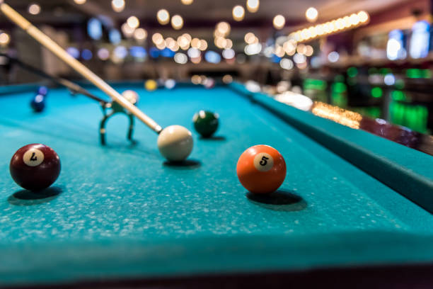 istock Billiard balls at table and rack for cue 1085203074