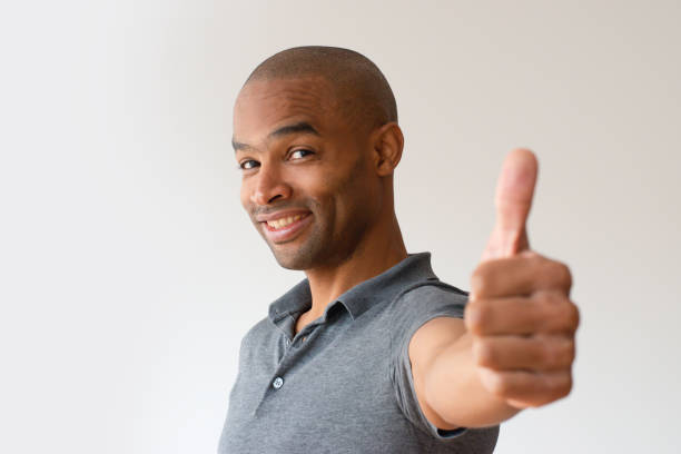 istock Happy Afro American guy recommending product 1085204658