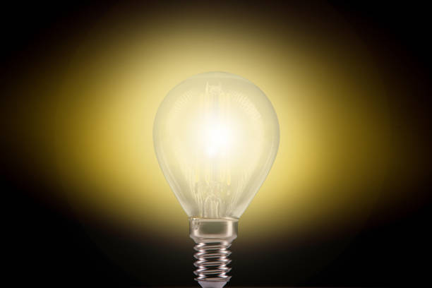 istock Silhouette led lamps against yellow background 1085205110