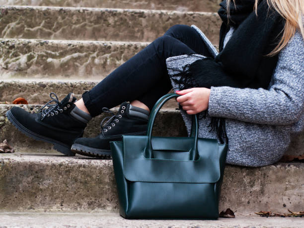 istock Girl with a green leather bag 1085207200