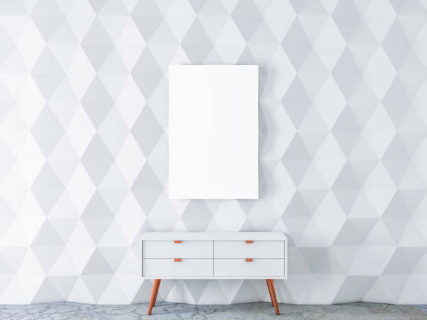istock White Vertical poster Mockup hanging on textured wall in modern interior with bureau 1085211486