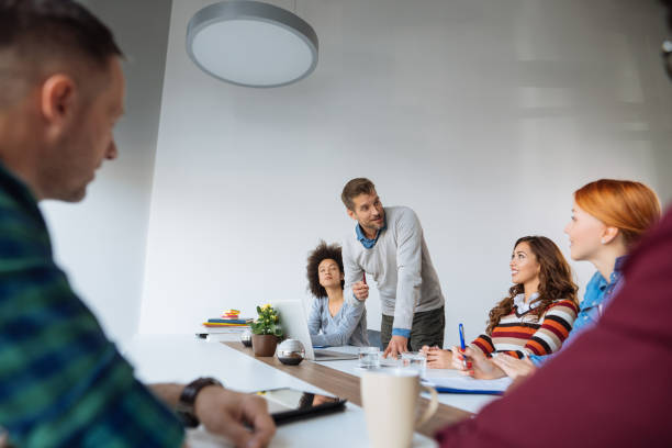 istock Multi racial group in business meeting, businessman explaining 1085212936