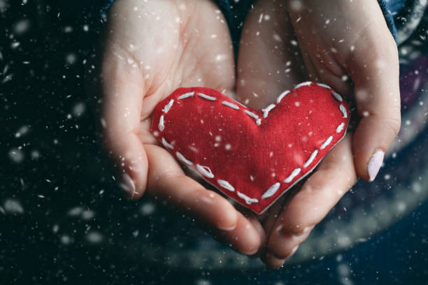 istock Female hands giving red heart. Close up. 1085215586