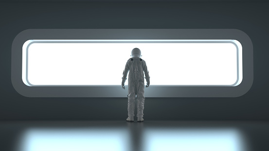 astronaut in front of a wide window